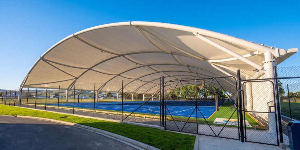 Large all-weather canopy over multisport courts